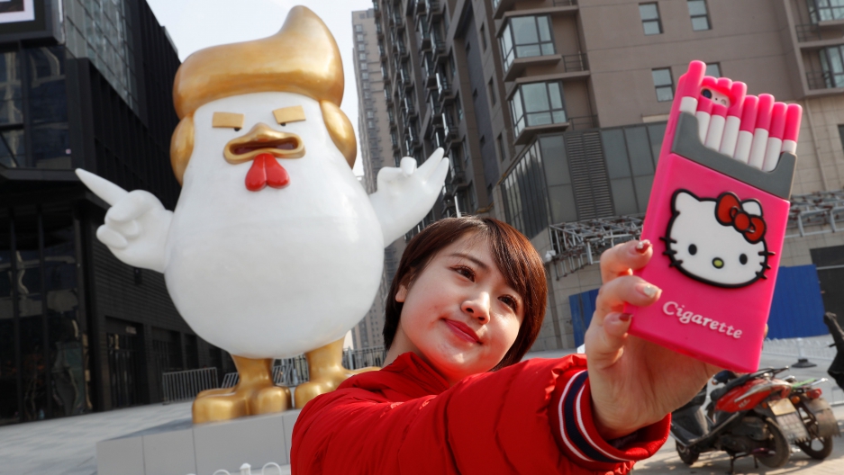 A selfie with blow-up Cock Trump. John Woo / Reuters