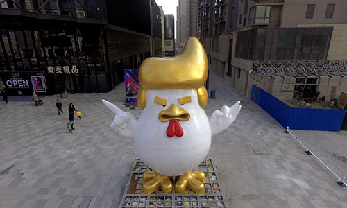 Celebrating 2017, Year of the Rooster. A statue with a Trump bonnet and grimace erected to celebrate the Chinese New Year in Taiyuan, Shanxi province.